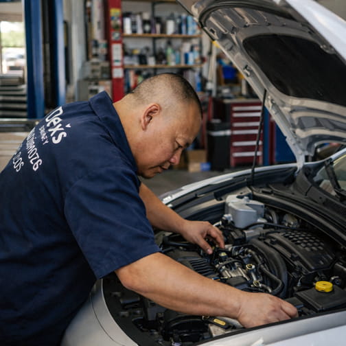 Dex’s Automotive owner performing engine diagnostics